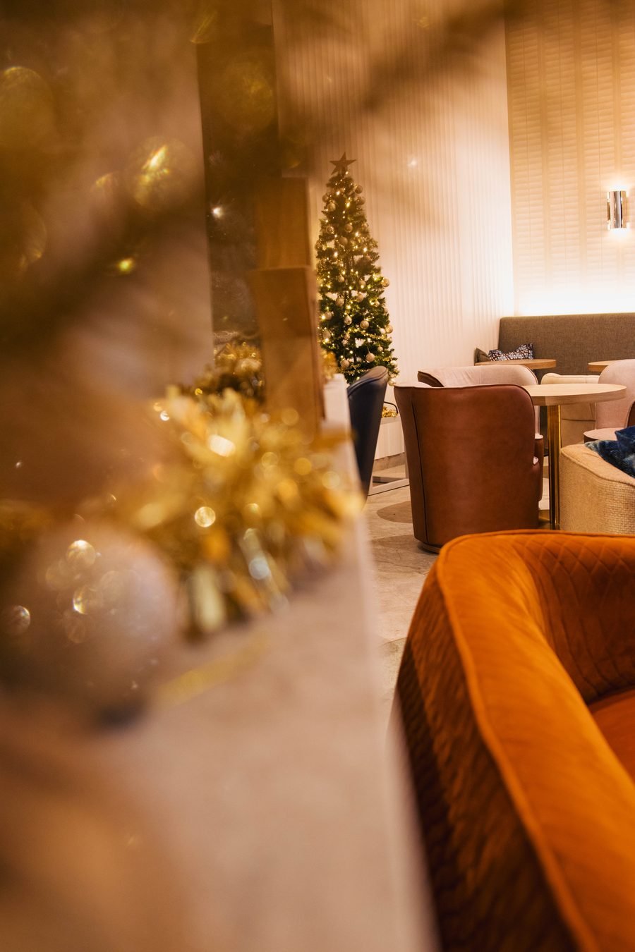 Baubles catching the light in the lounge dressed for Christmas