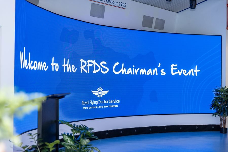 Curved screen reading Welcome to the RFDS Chairman's Event